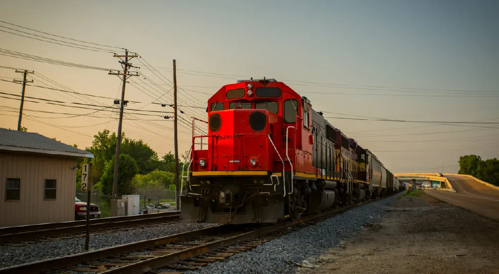 Railroad and train, representing large-volume custom travel programs designed for workforce lodging needs.